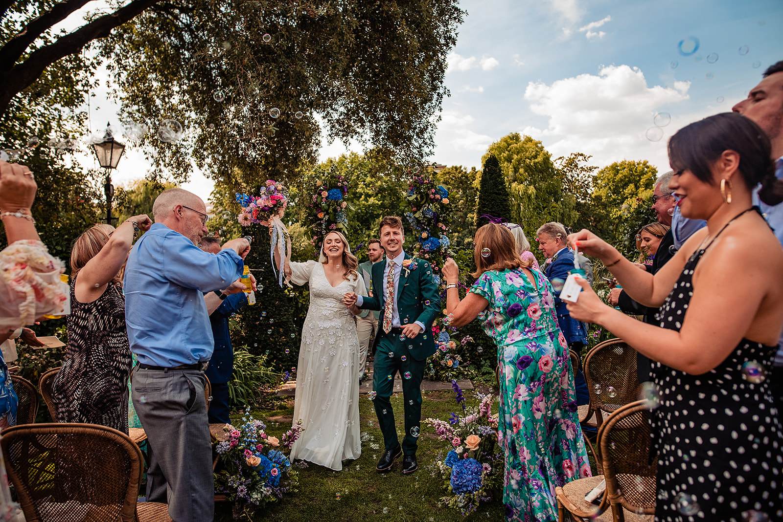 An alternative to confetti is bubbles, Steph & Jack are walking down the isle surrounded by their guests blowing bubbles. 