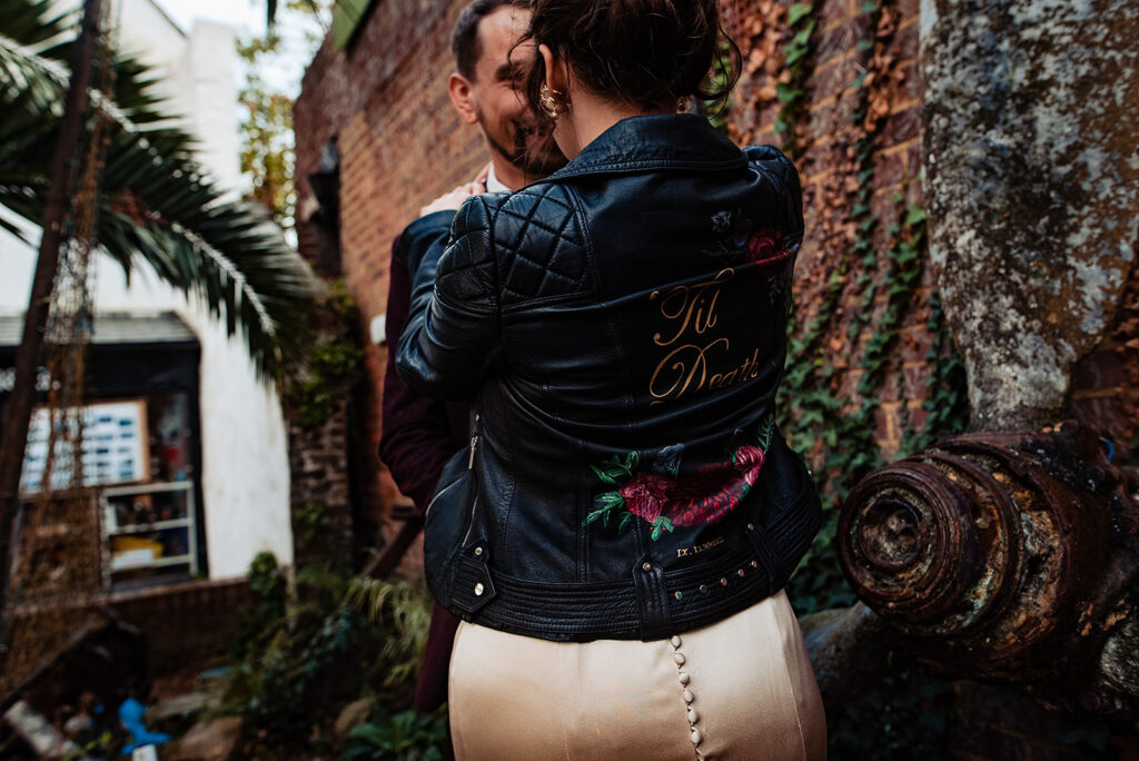 Details from a couple's shoot with a bride and groom after their wedding ceremony. The bride wears a leather jacket and embroidered trainers in a goth chick vibe.