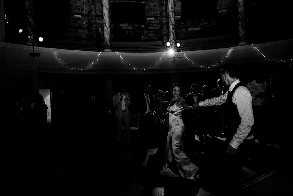 An Alternative wedding: Dancing moments from the wedding reception party of the band night. The bride and groom spin out.