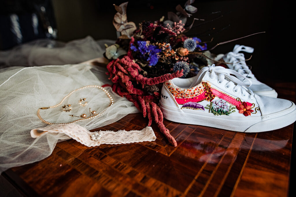 An Alternative wedding: A goth chick wedding, with details on the shoes, dried flower bouquet and pearl necklace and earrings. 