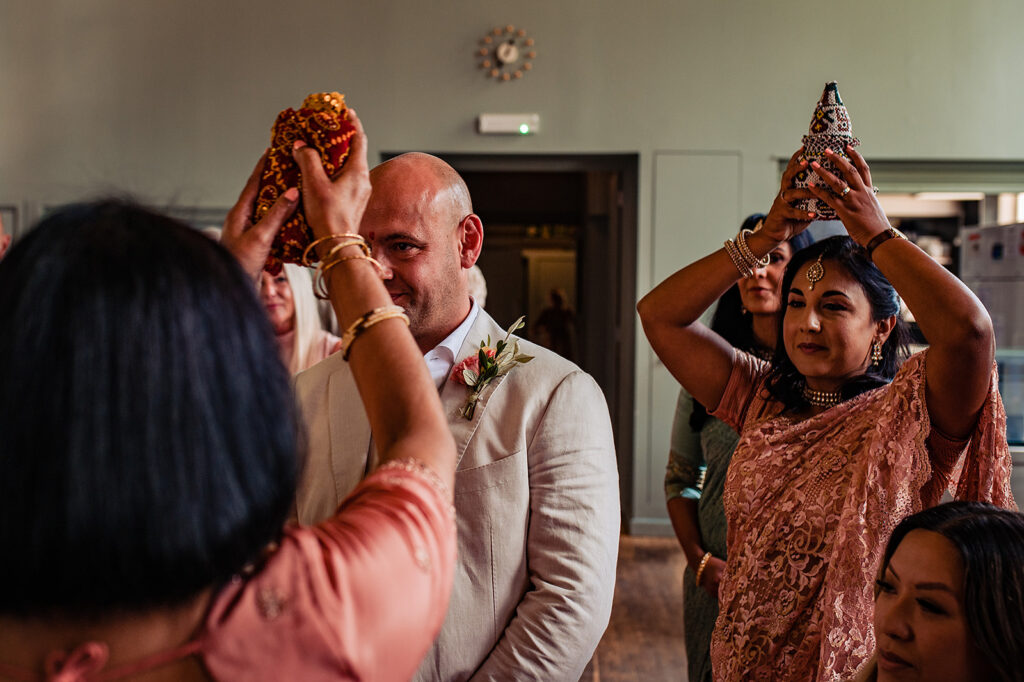 Traditional Hindu ceremony events with the mother of the bride, and the groom